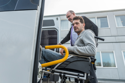 man on wheelchair entering the van